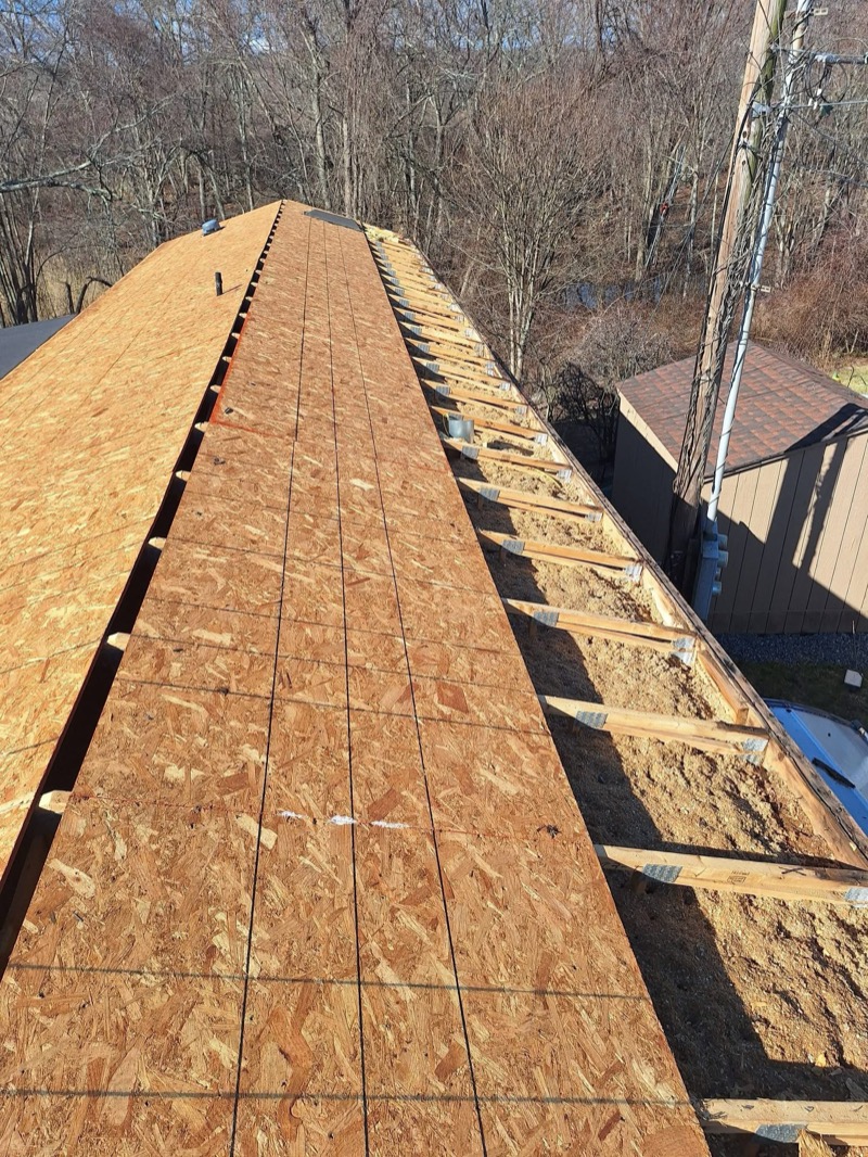 Bare roof decking from ridge